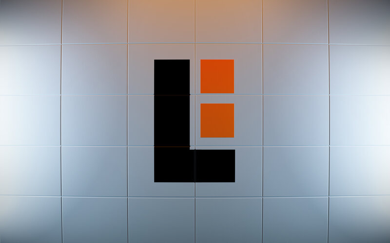 abstract logo on tiled wall