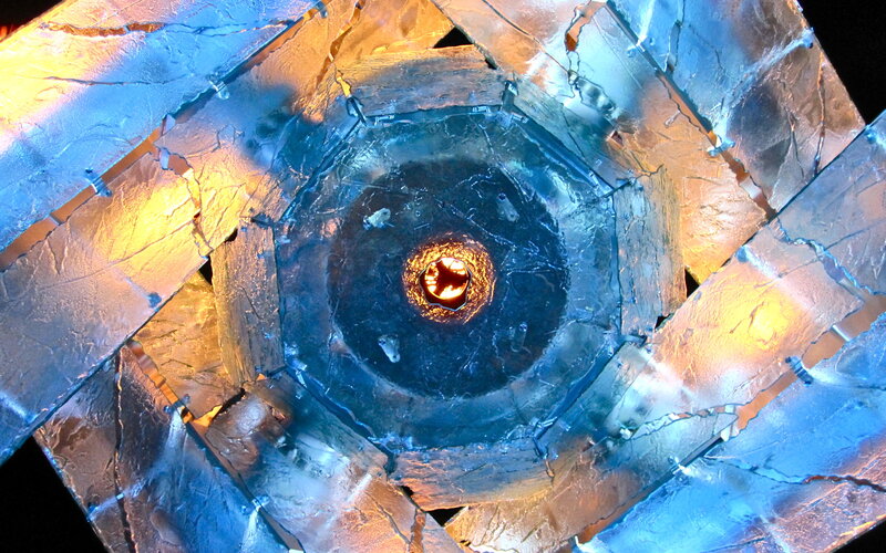 Abstract metallic sculpture with central light