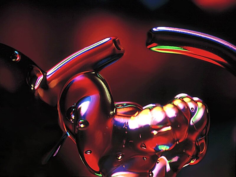 Abstract metallic sculpture with light reflections
