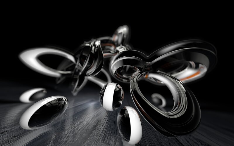 Abstract metallic shapes on dark surface