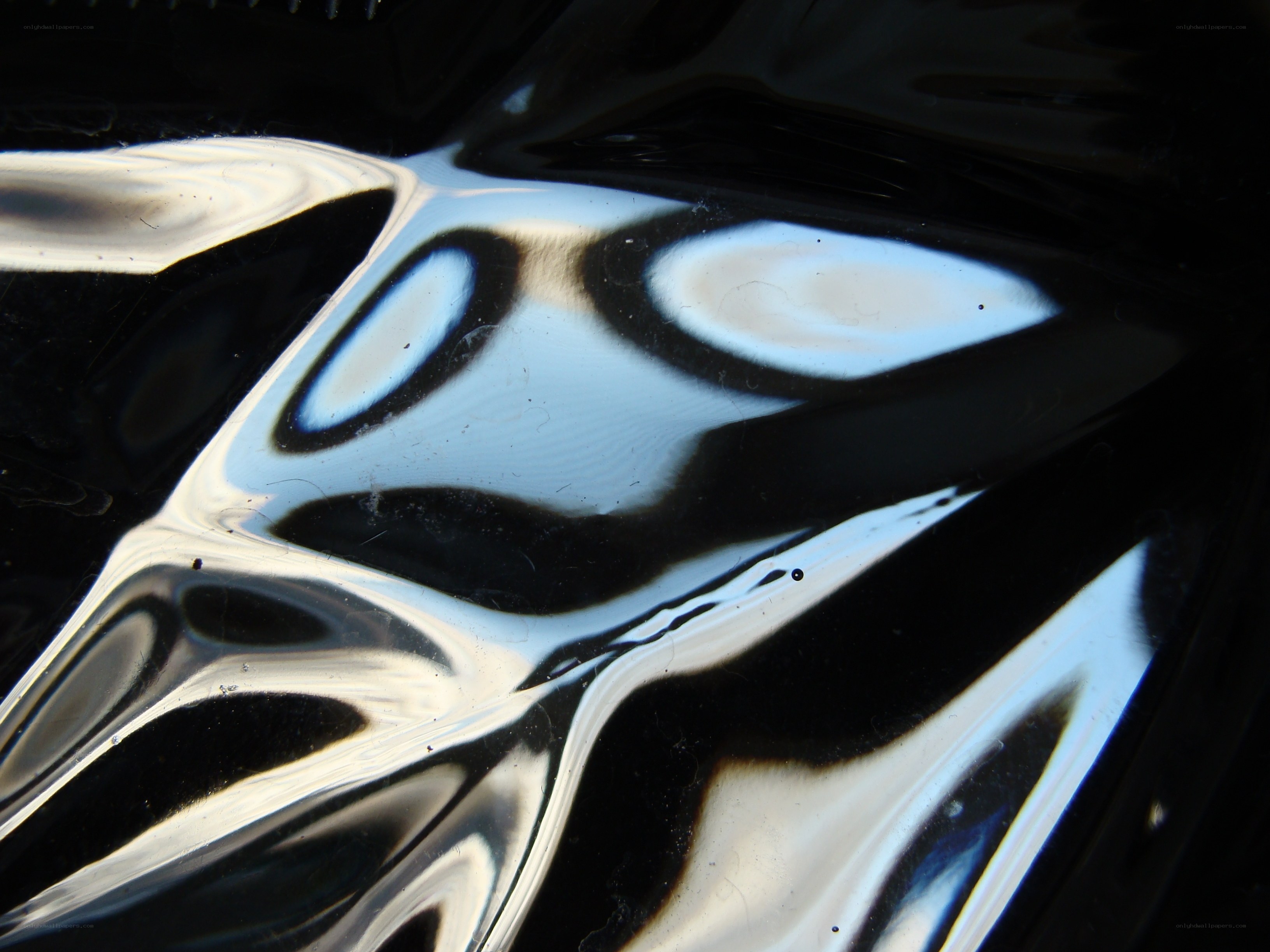 Abstract reflection on black surface