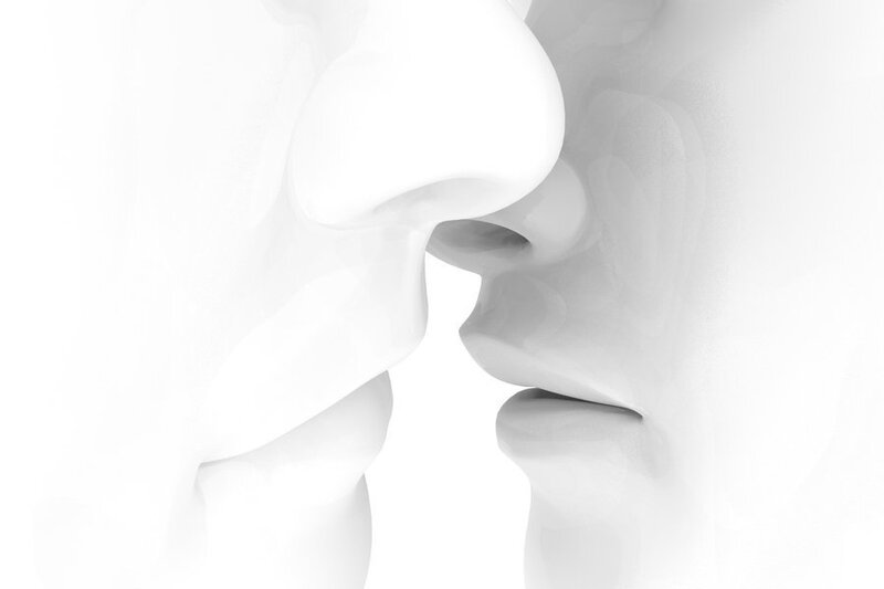 abstract sculpture of kissing faces