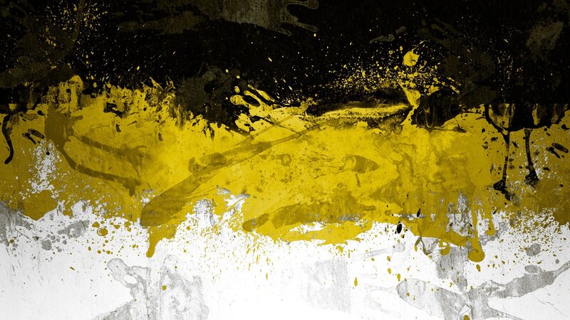 abstract yellow and black paint splatter