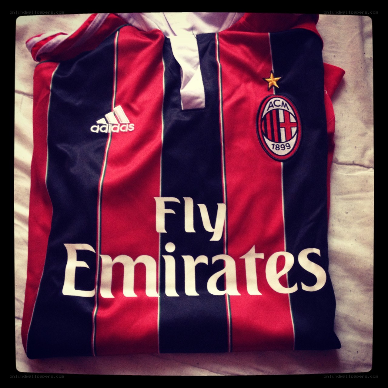 AC Milan jersey on bed