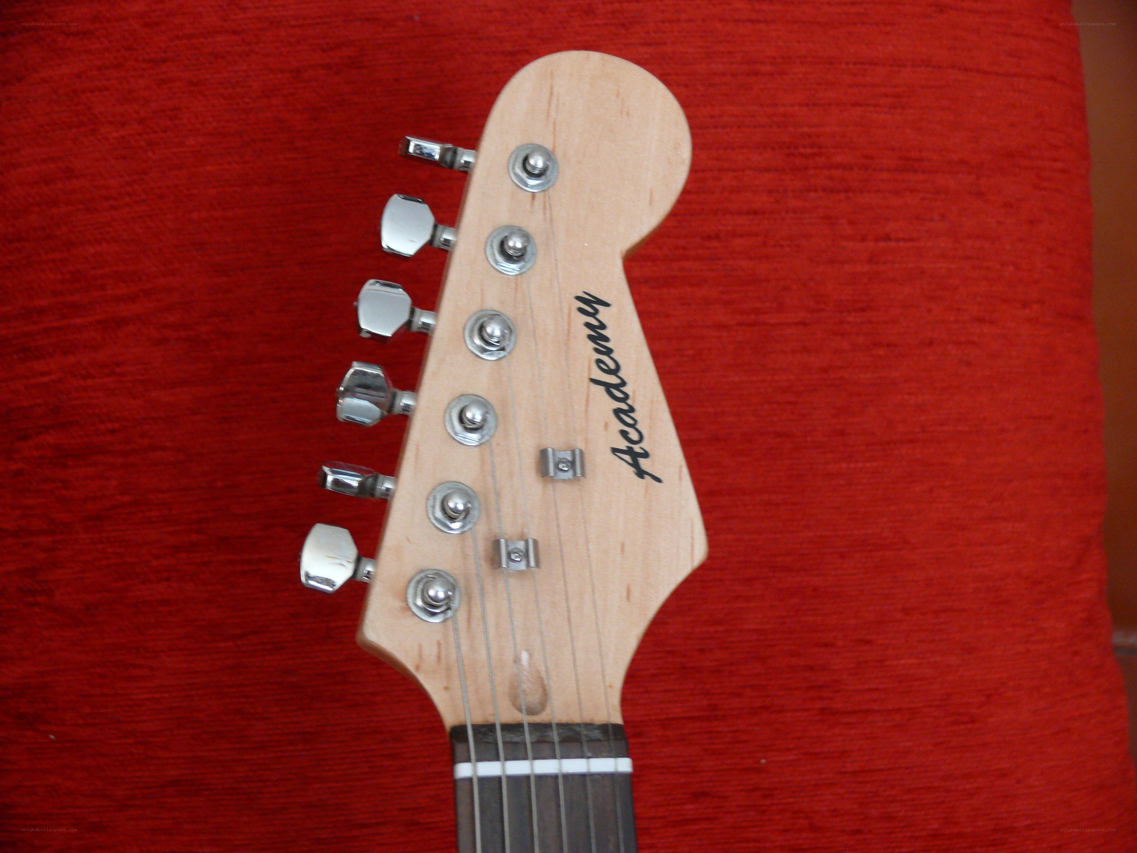 Academy guitar headstock