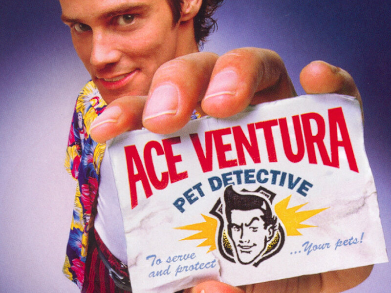 Ace Ventura holding business card