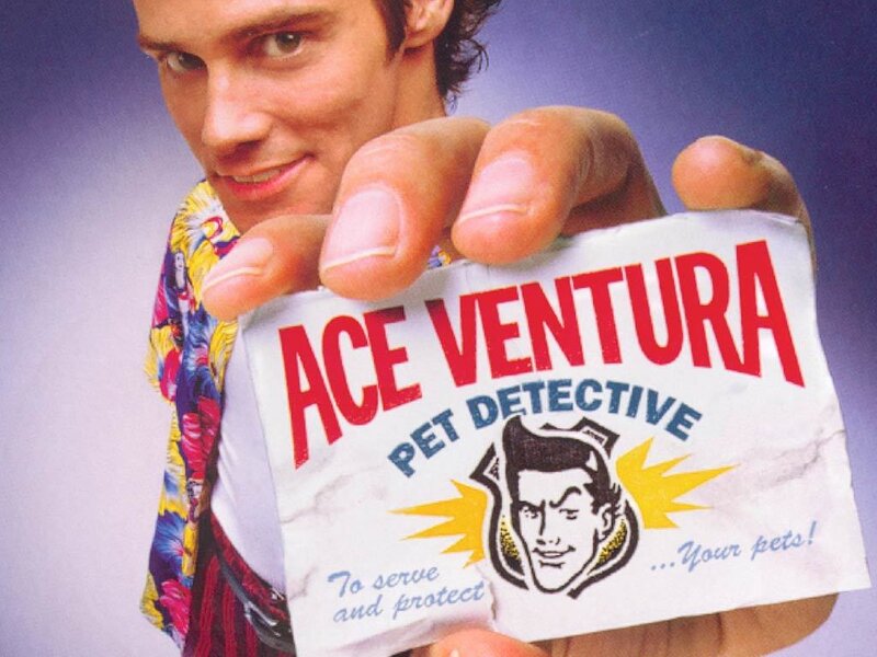 Ace Ventura holding business card