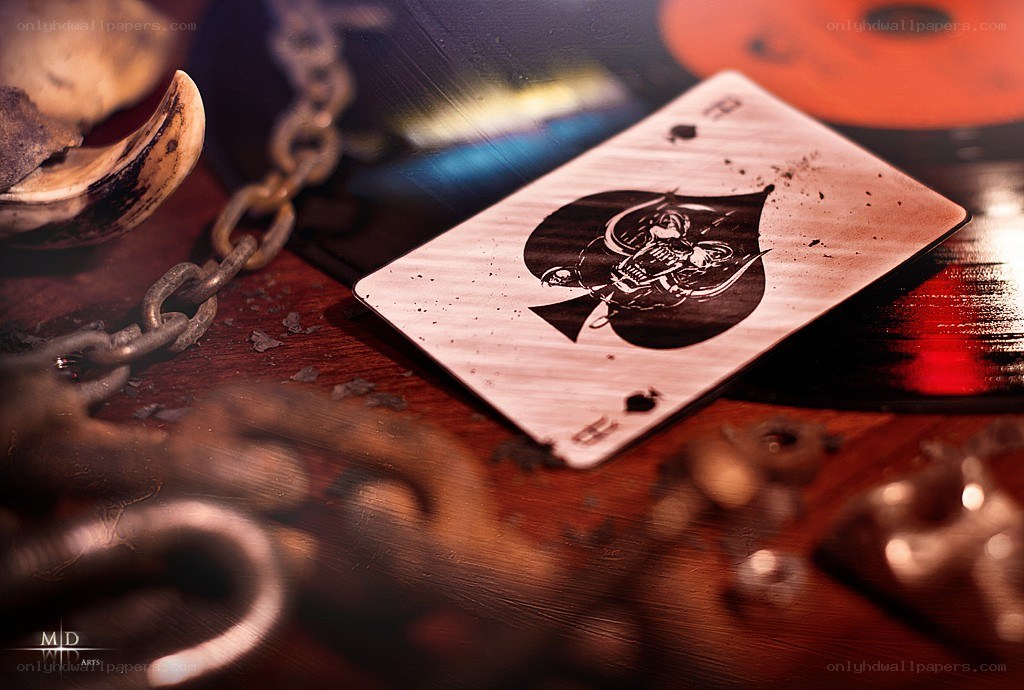 Aces and chains on a wooden table
