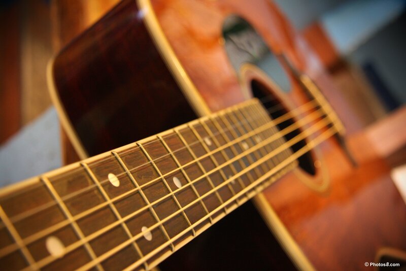 acoustic guitar fretboard close-up