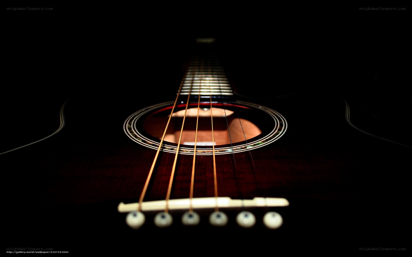 Acoustic guitar in darkness