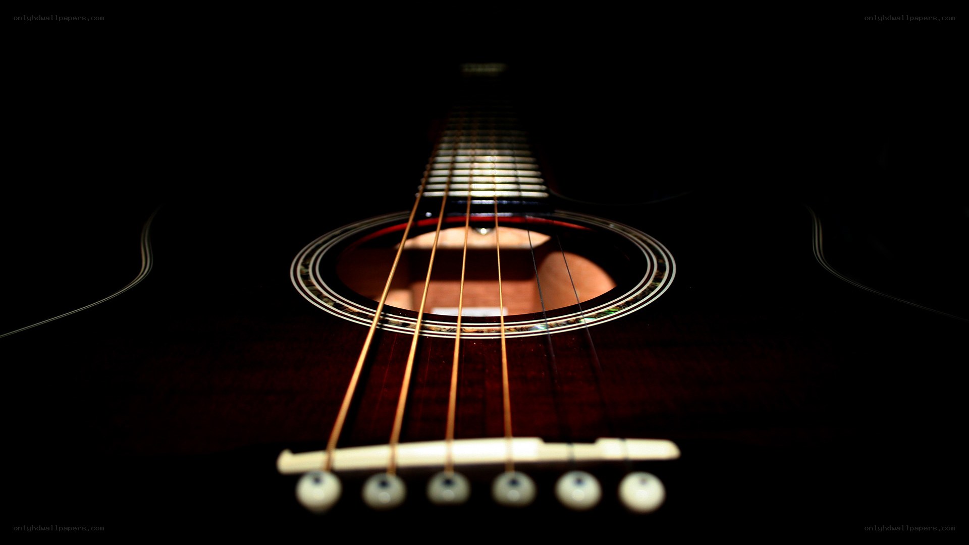Acoustic guitar in darkness
