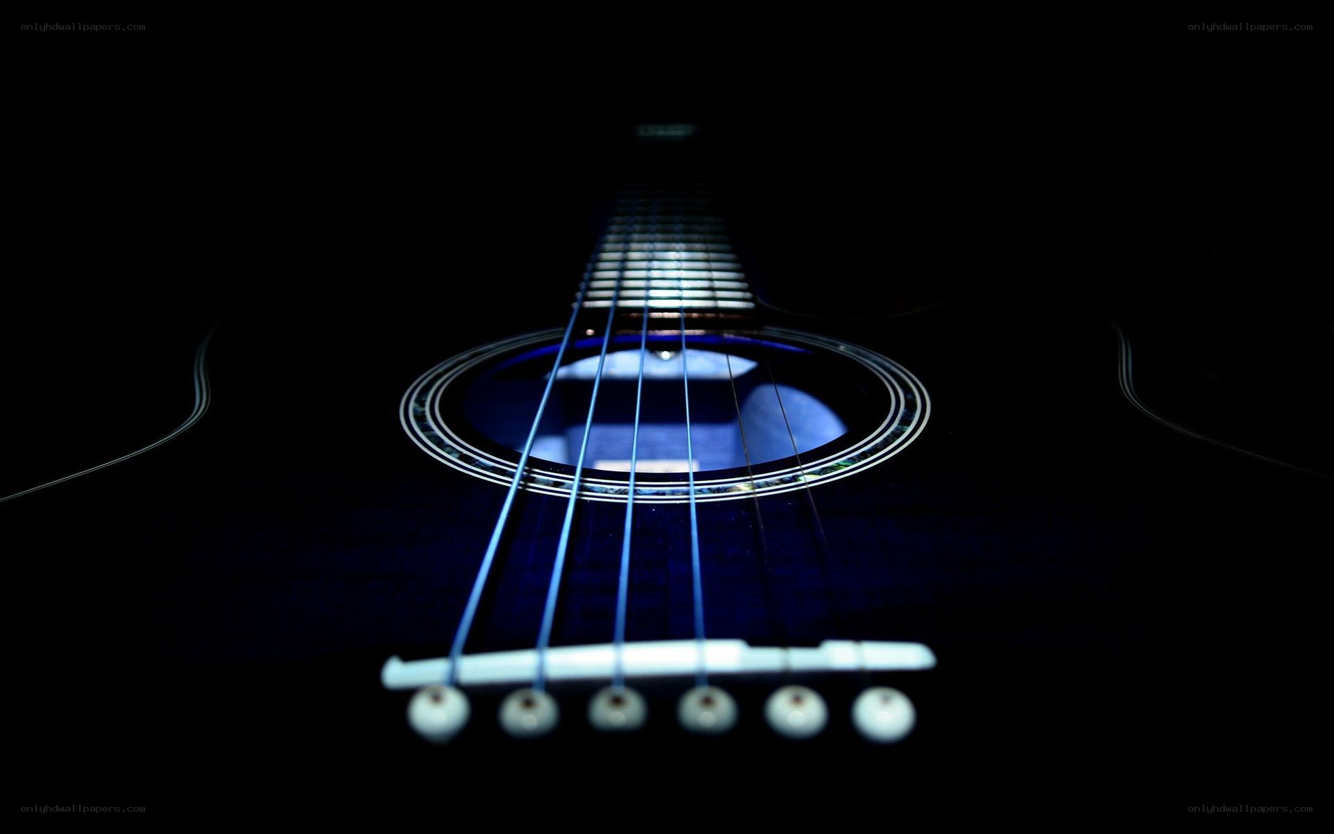 Acoustic guitar in darkness