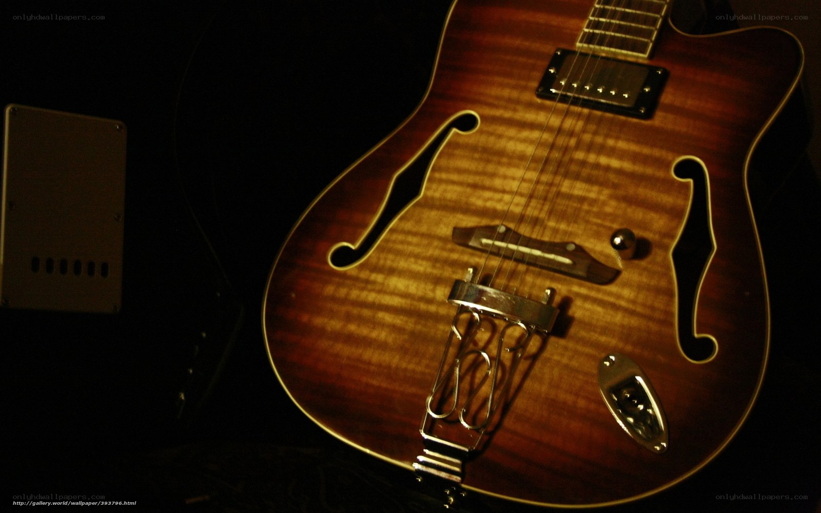acoustic guitar in dim light