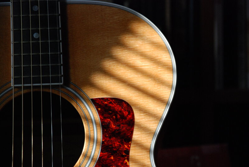 Acoustic guitar in sunlight