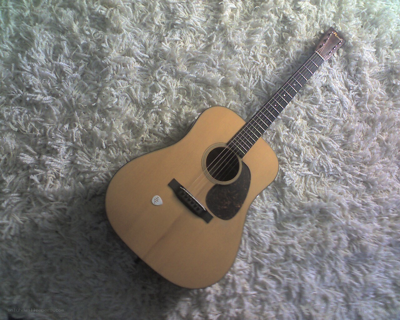 acoustic guitar on carpet