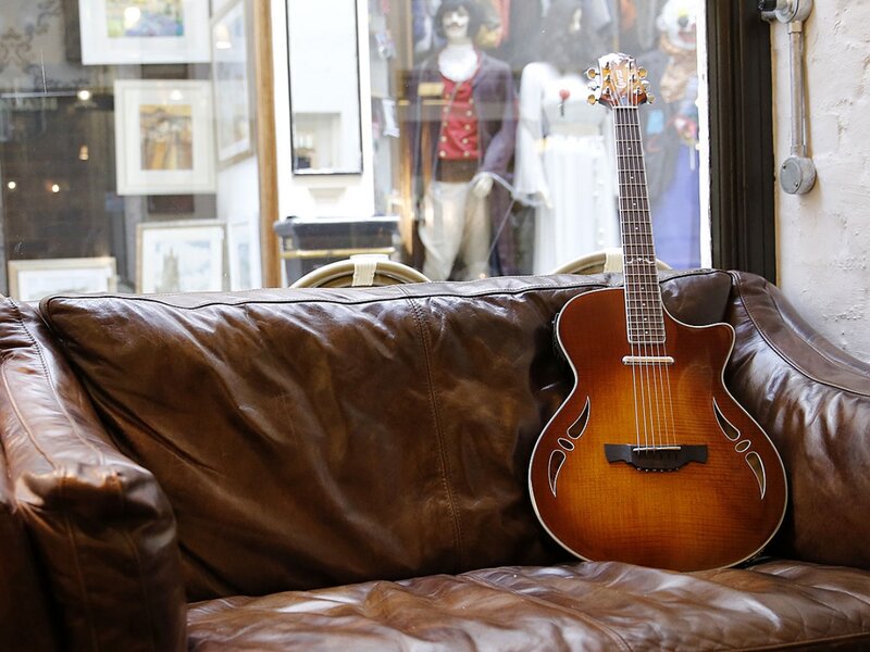 Acoustic Guitar on Couch