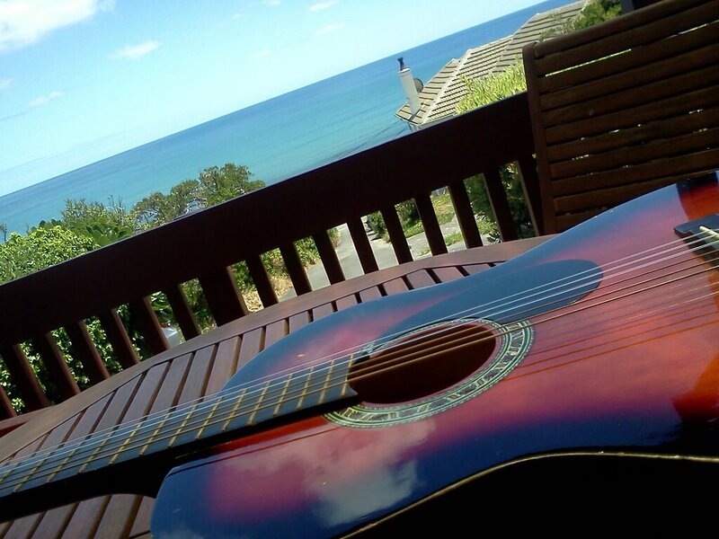 Acoustic Guitar on Deck — Brown