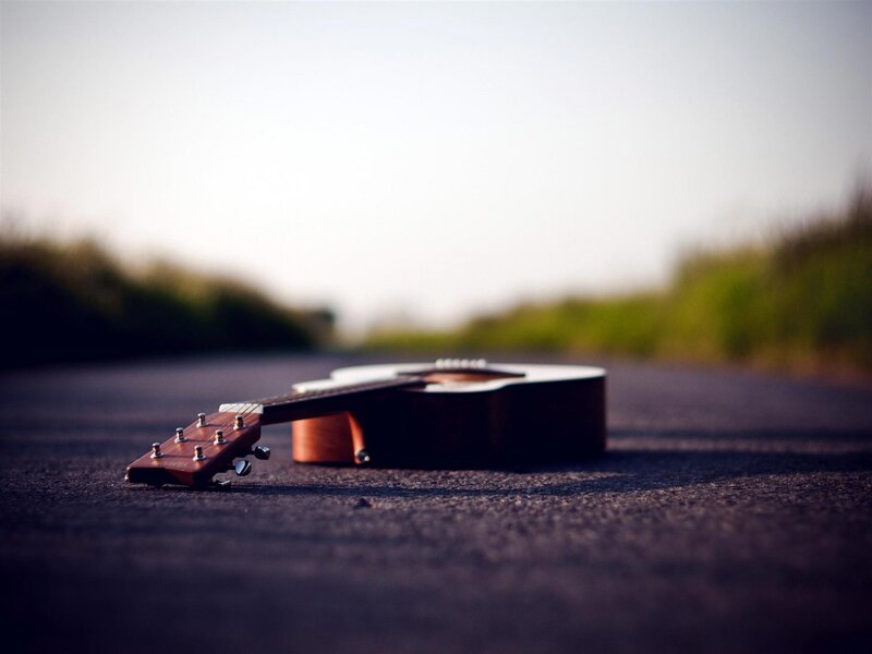 Acoustic Guitar on Road — Brown