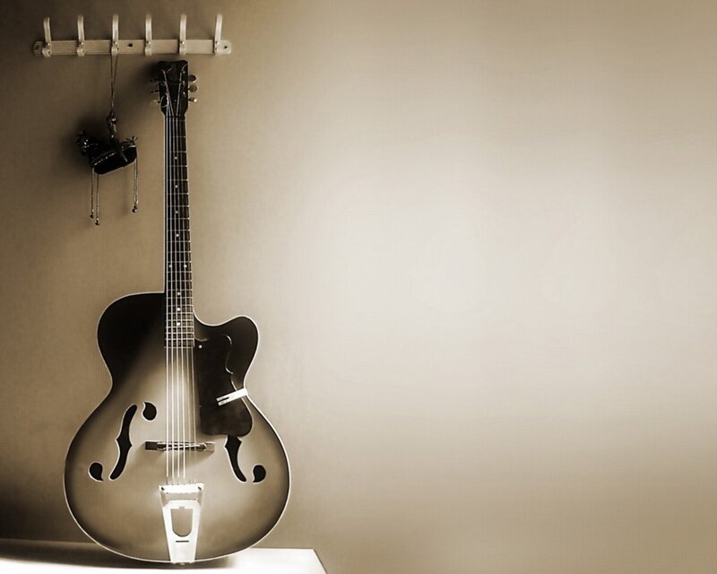 acoustic guitar on wall