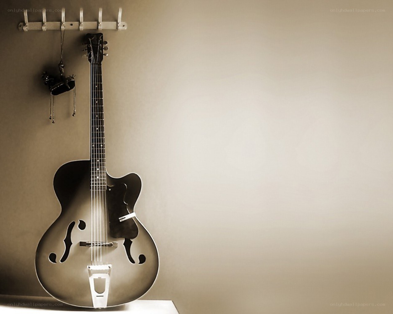 acoustic guitar on wall