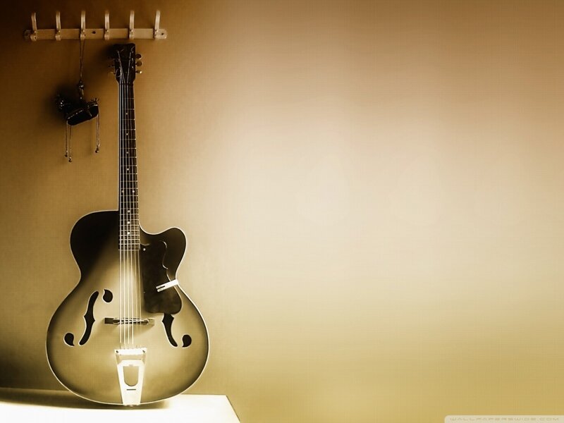 Acoustic Guitar on Wall — Brown