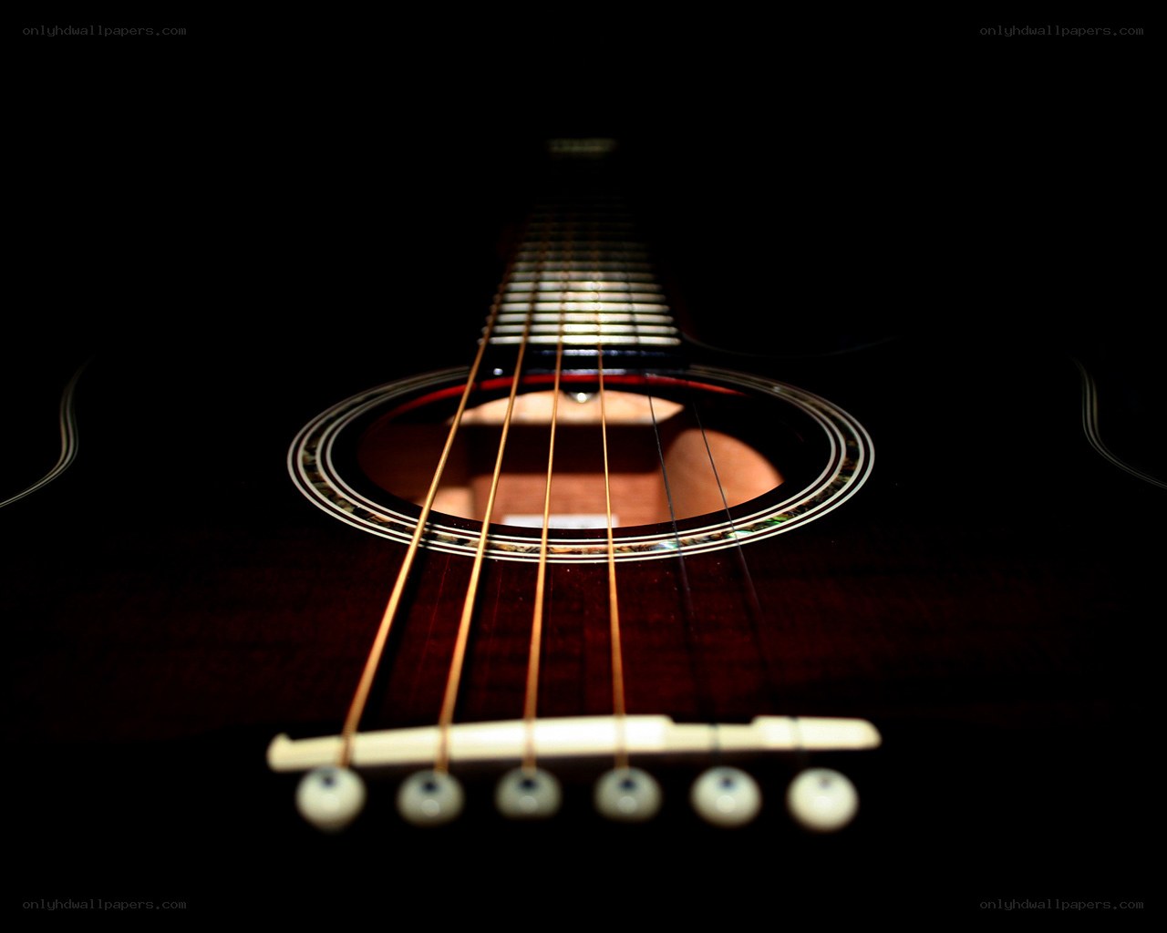 Acoustic guitar strings and soundhole