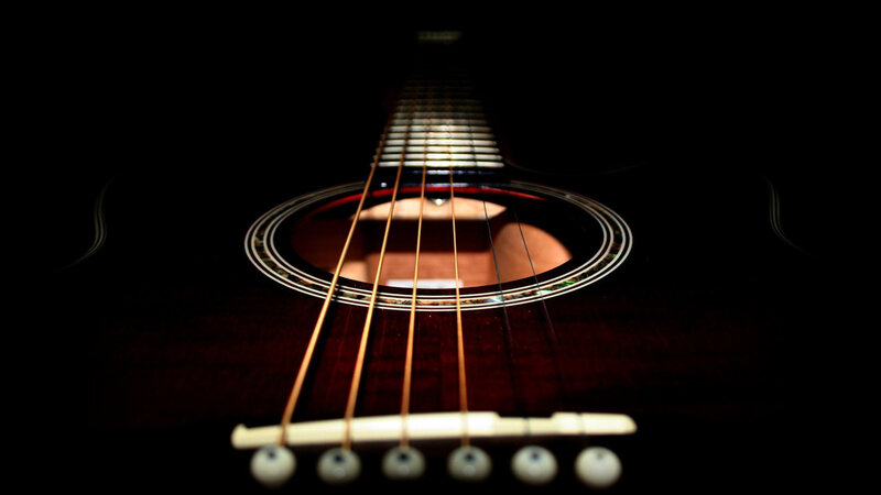 Acoustic guitar strings and soundhole