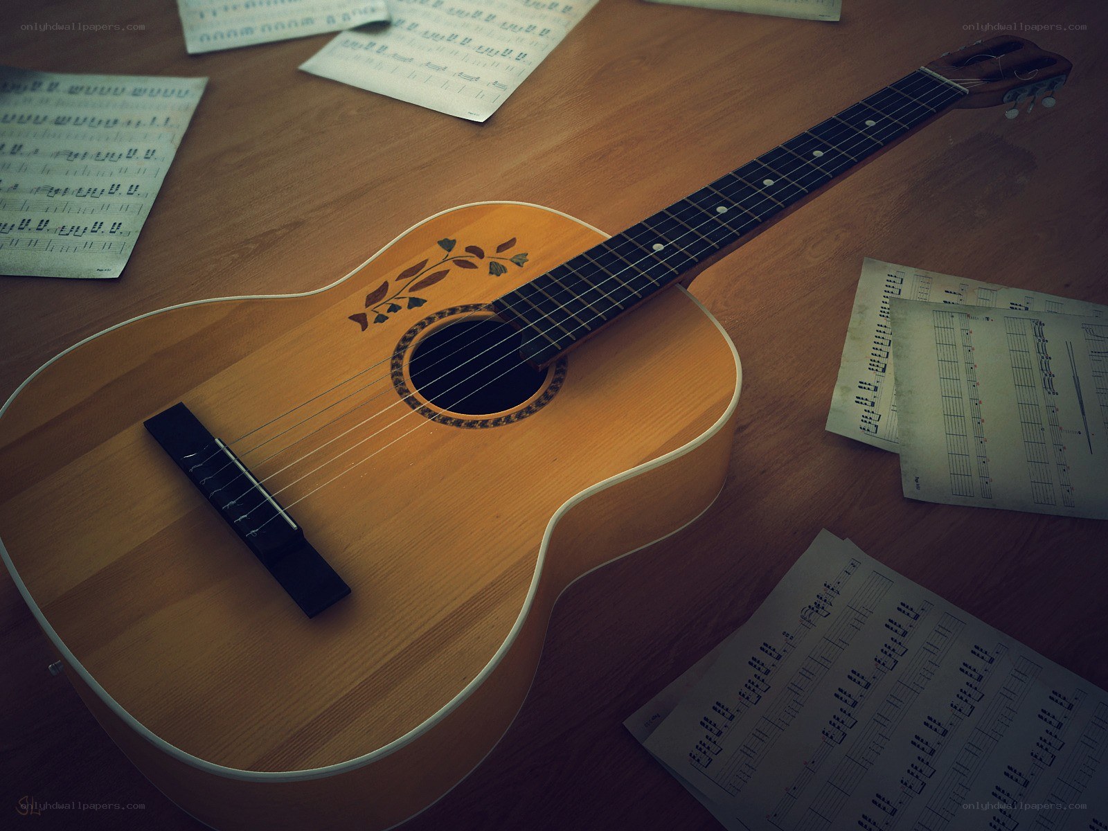 Acoustic guitar with sheet music