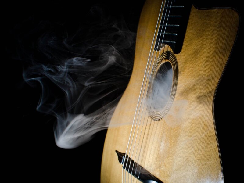 Acoustic guitar with smoke
