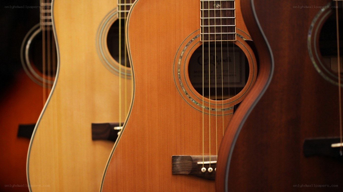 acoustic guitars in a row