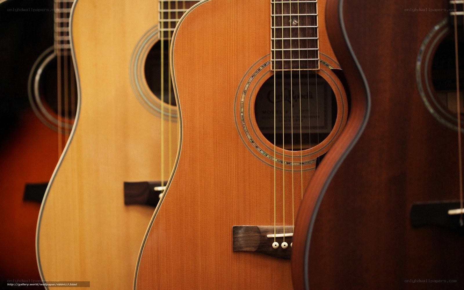 acoustic guitars in a row