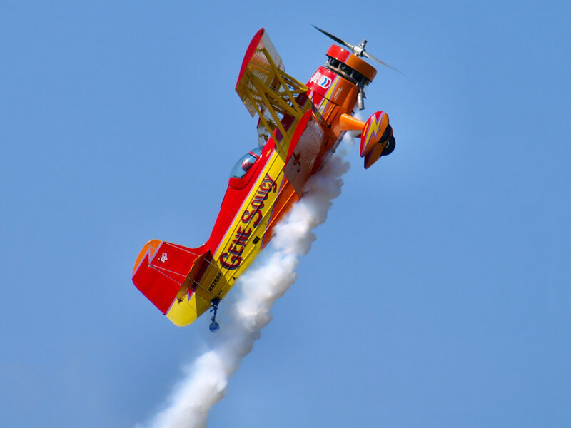 Acrobatic biplane in flight