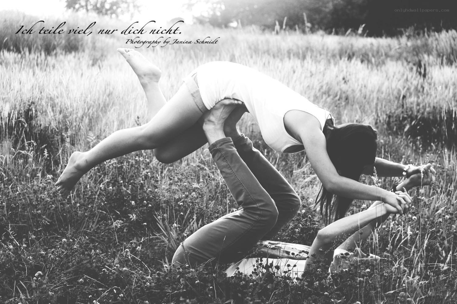 Acrobatic couple in field