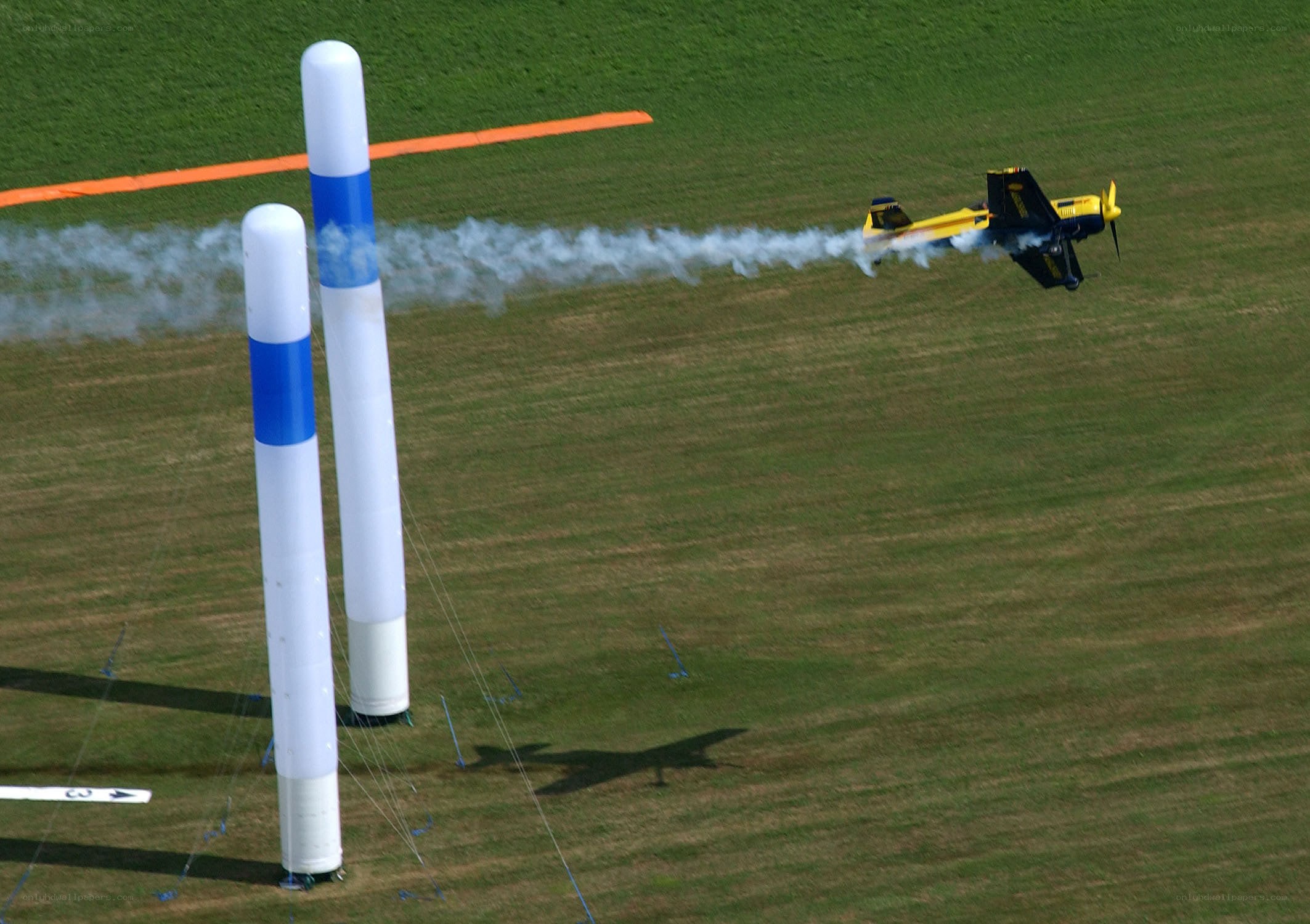 Acrobatic plane flying through course