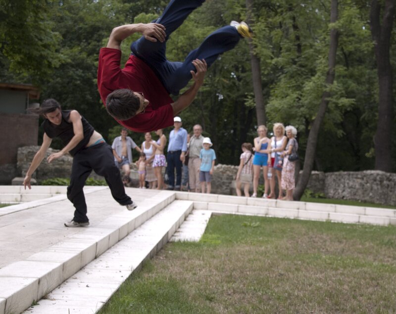 Acrobats performing in a park