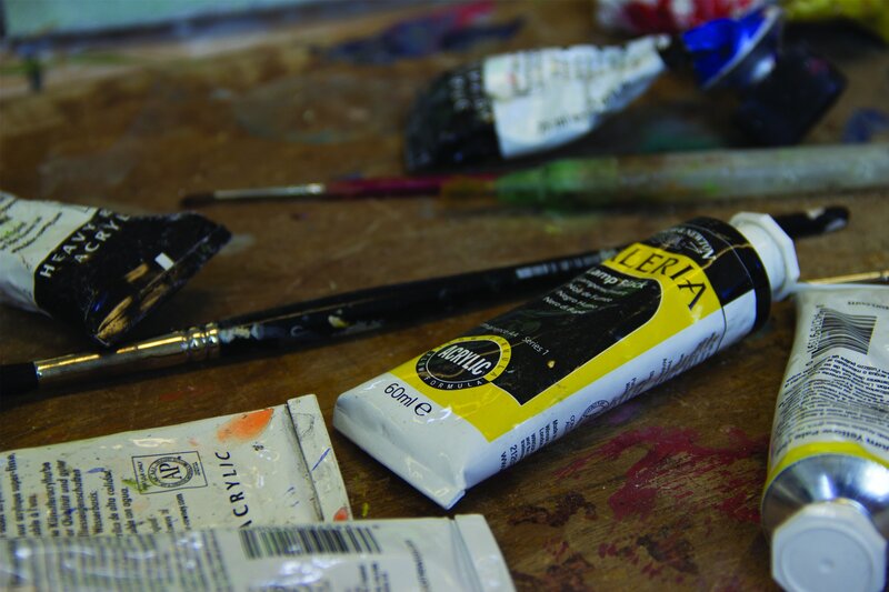 Acrylic paint tubes on a workbench