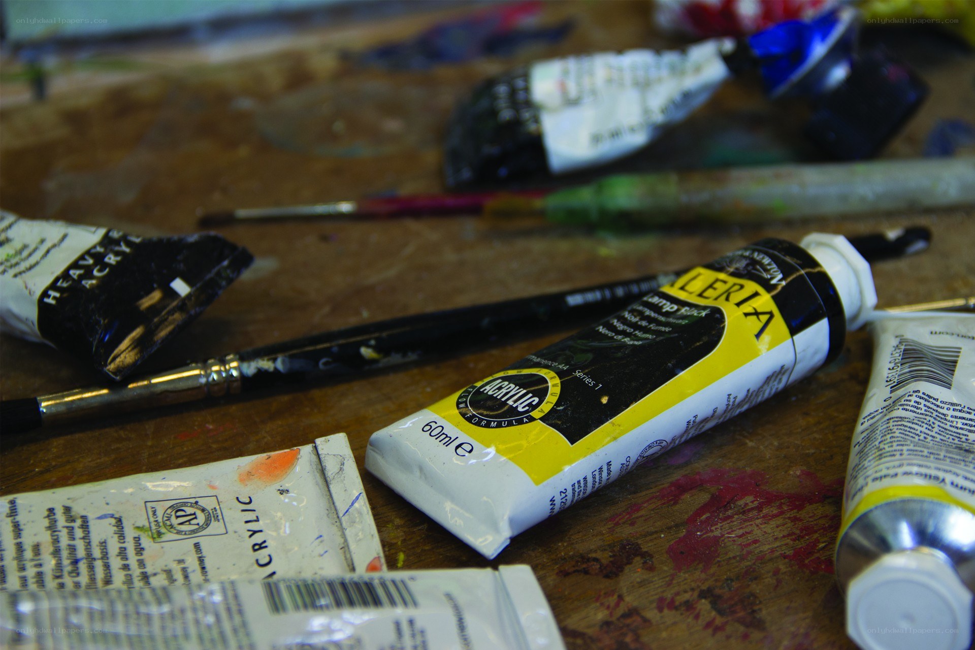 Acrylic paint tubes on a workbench