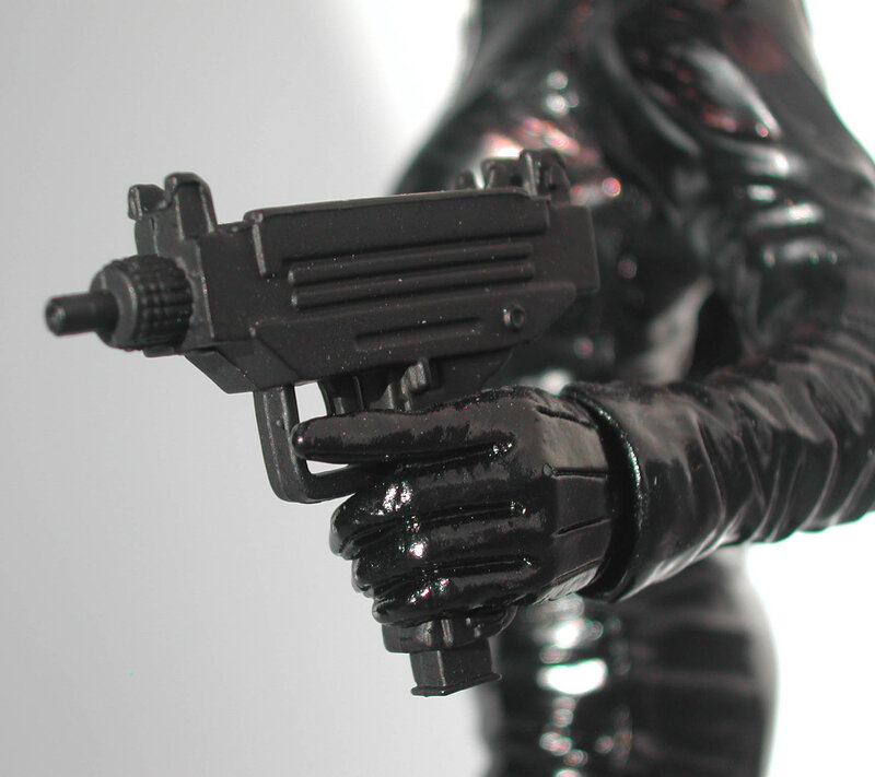 action figure holding gun