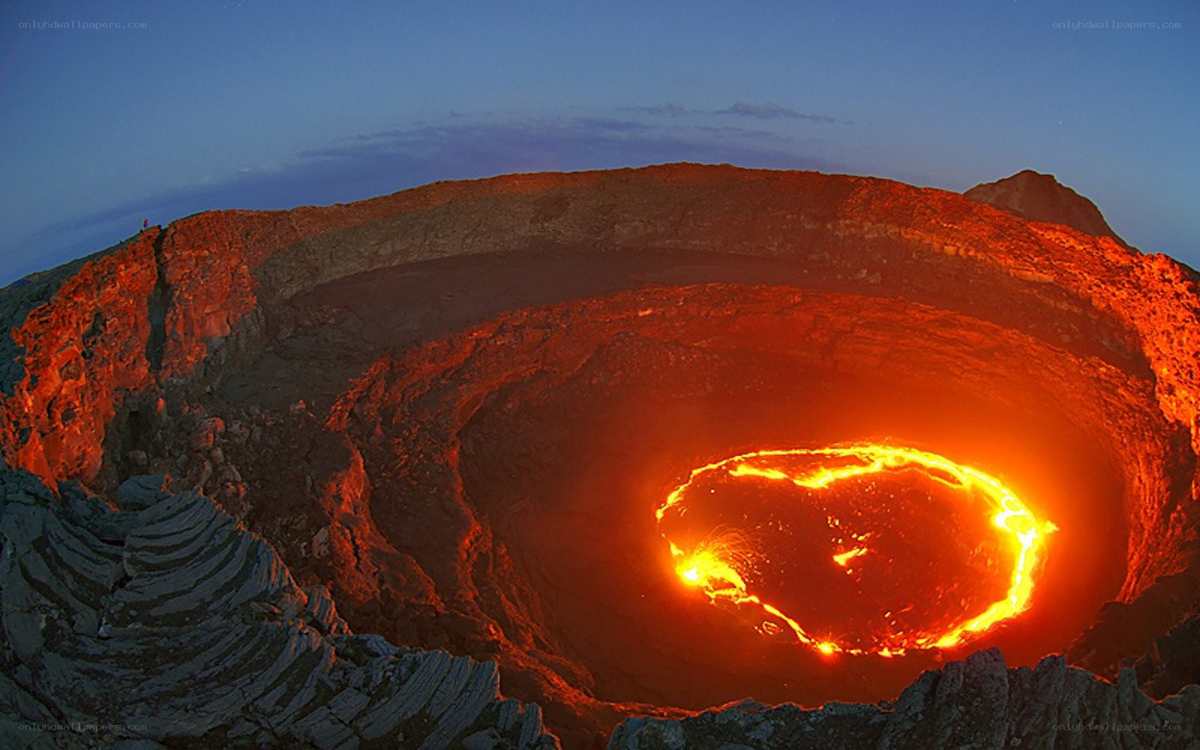 Active volcano crater at dusk