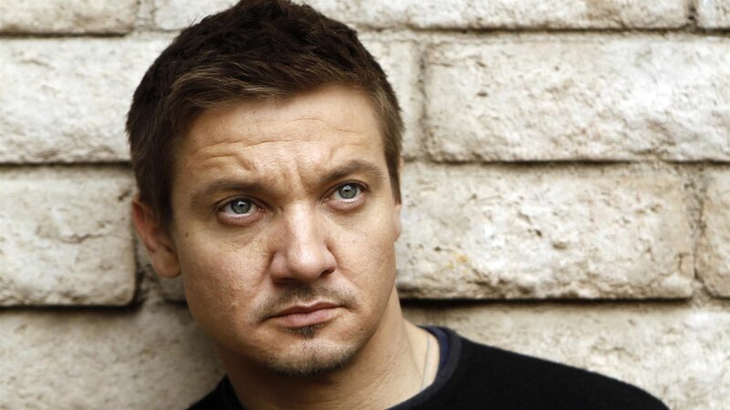 actor against brick wall
