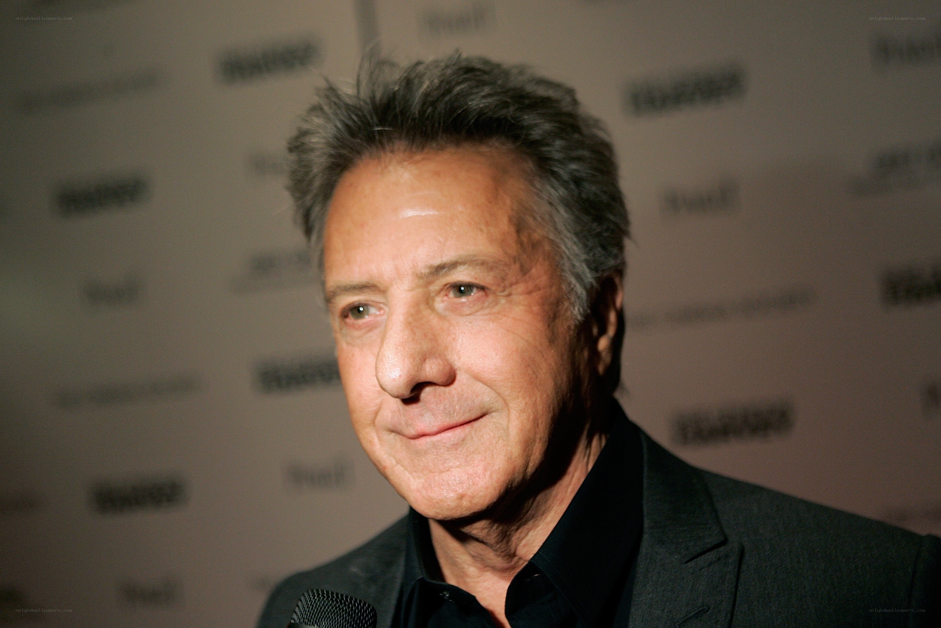 actor at event with microphone