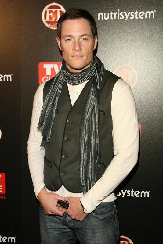 actor at event with scarf