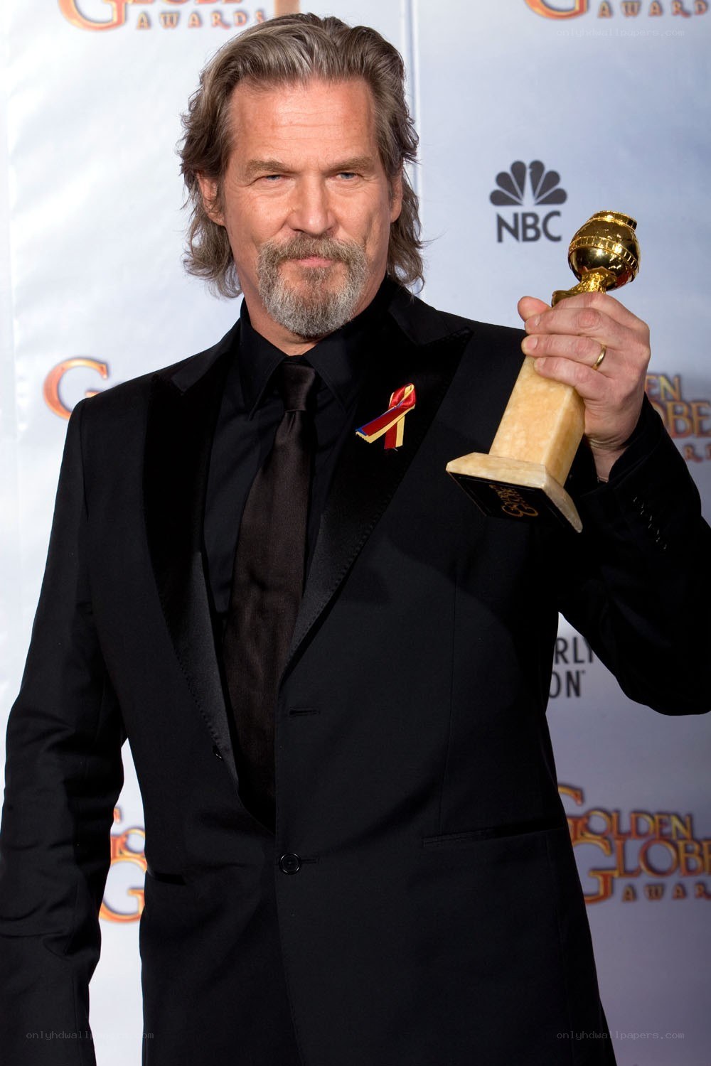 Actor holding Golden Globe award