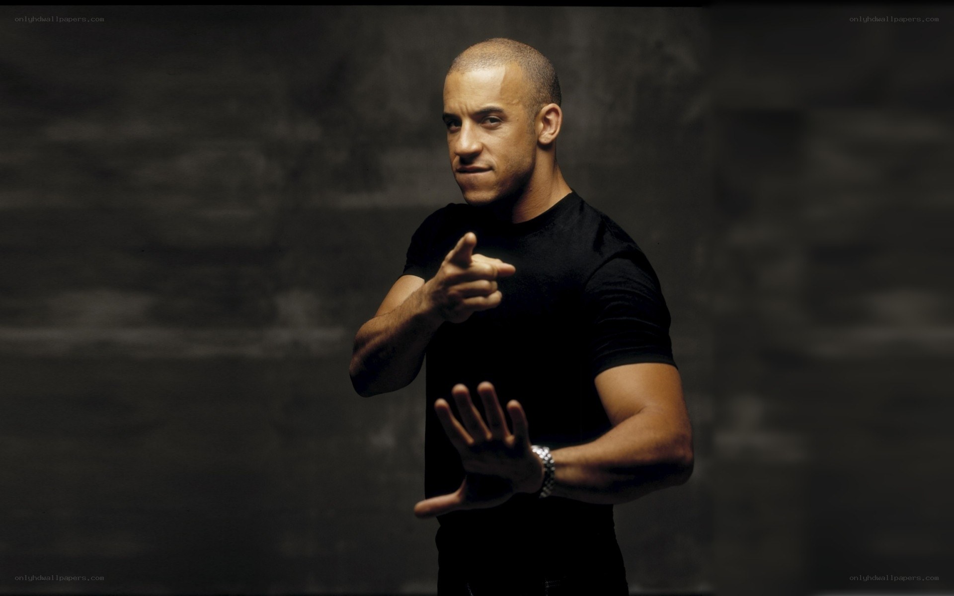 actor in black shirt pointing