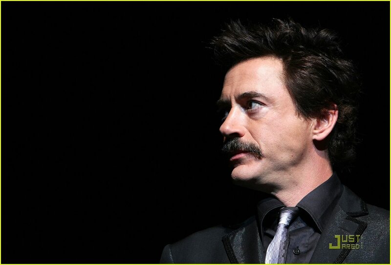 actor in black suit