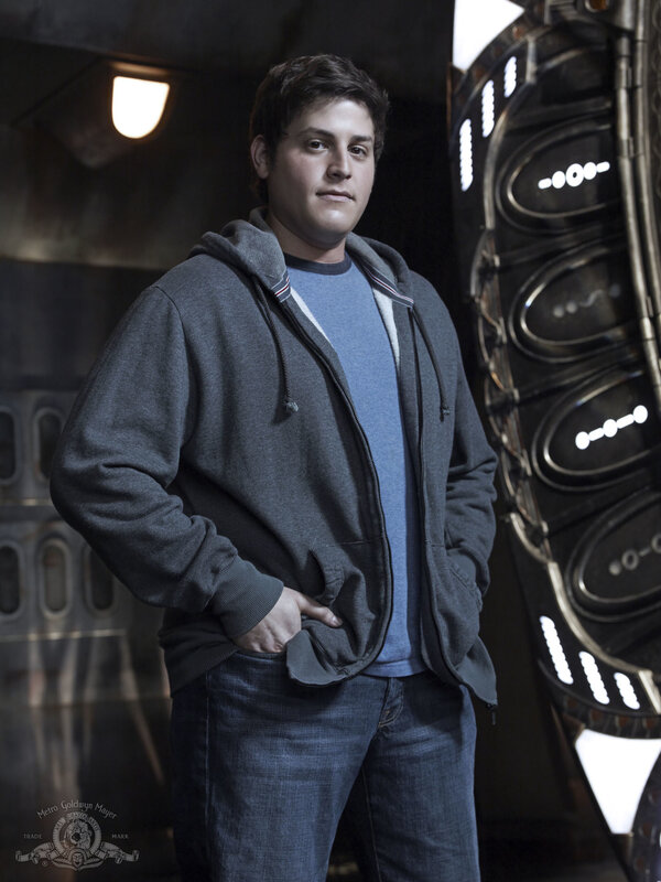 actor in hoodie on set
