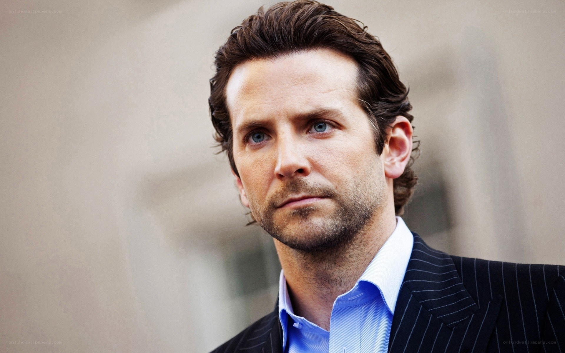 actor in pinstripe suit