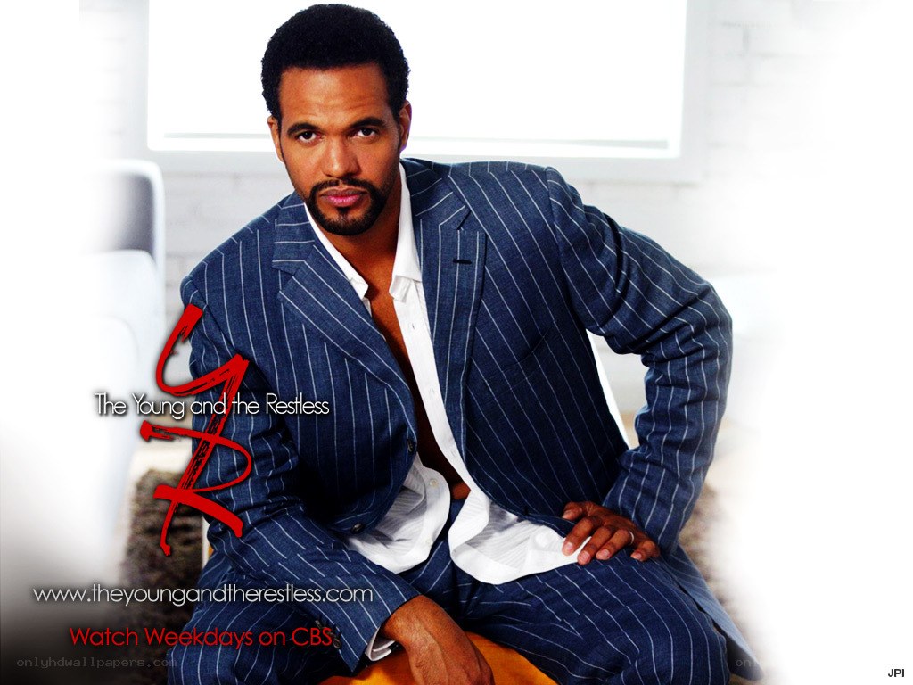 actor in pinstripe suit