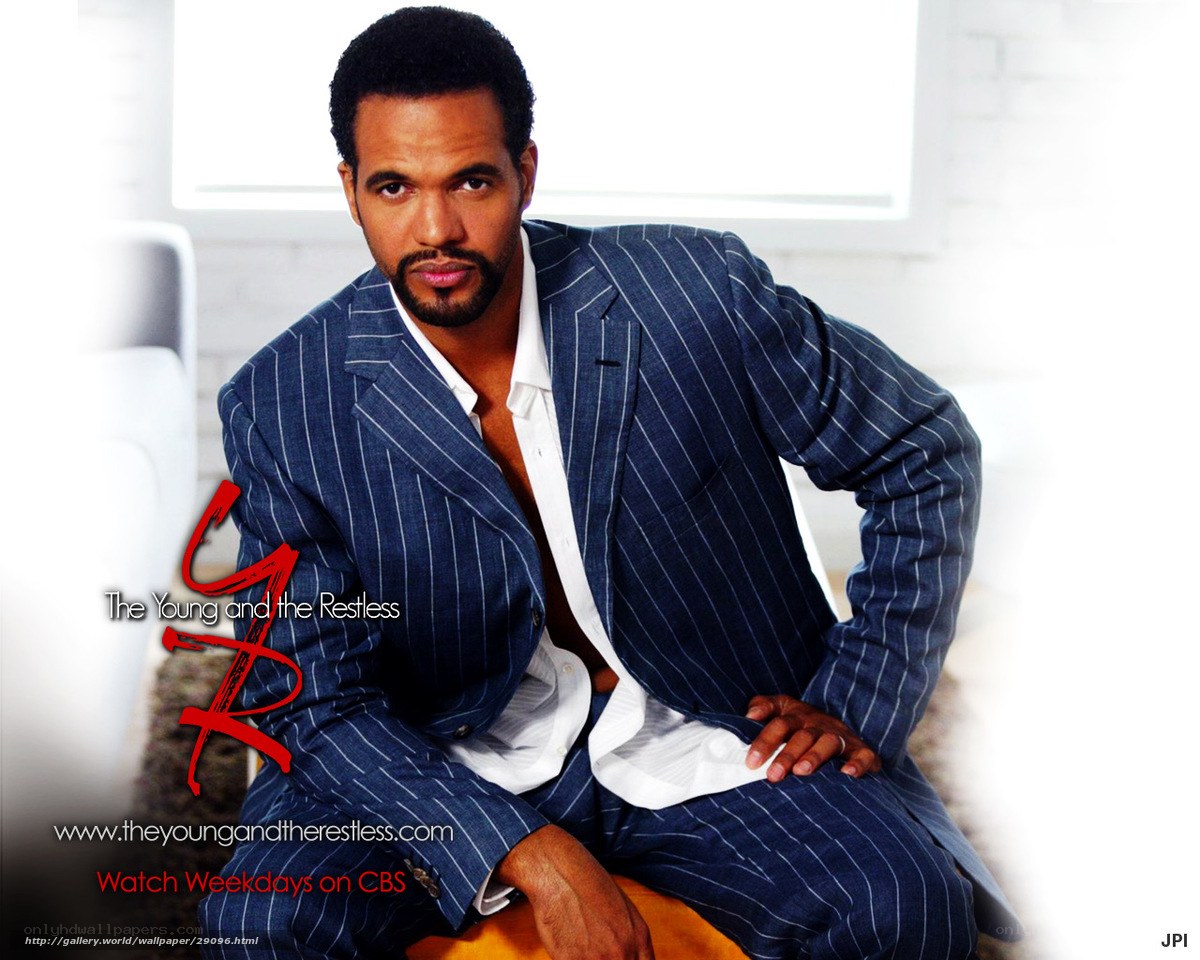 actor in pinstripe suit