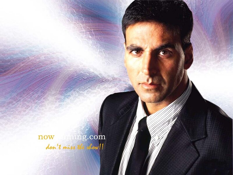 actor in suit with abstract background